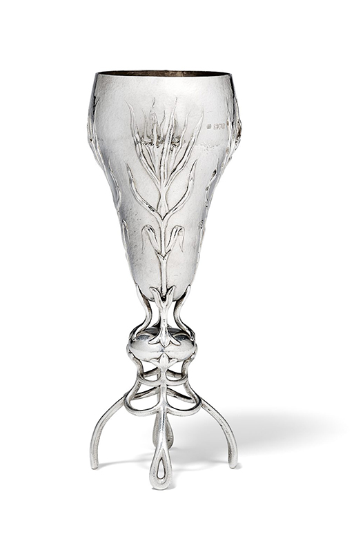 A repoussé silver vase by Gilbert Marks