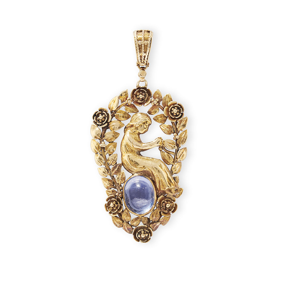 A gold and sapphire mounted pendant by John Paul Cooper (1869-1933)