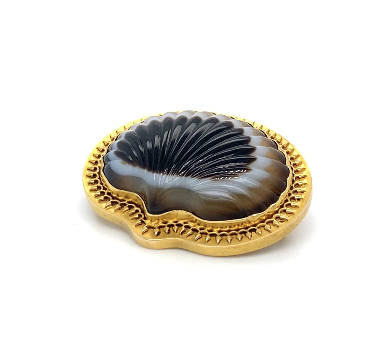 An antique carved agate brooch