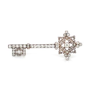 An antique diamond set key brooch