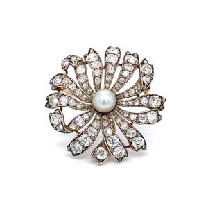 A pearl and diamond daisy brooch