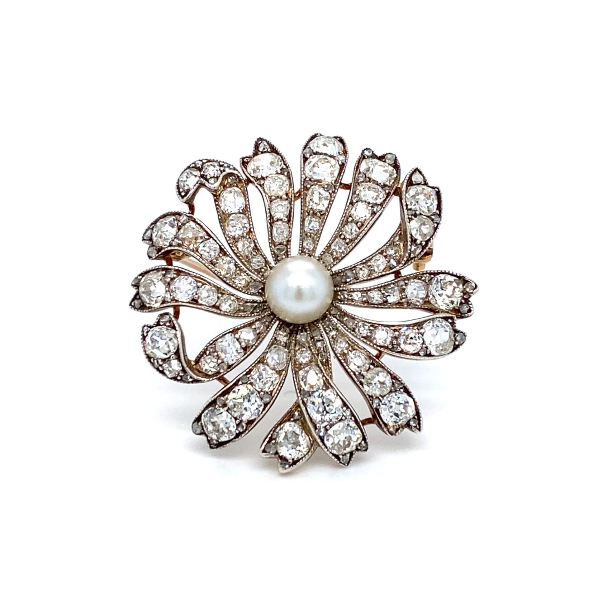 A pearl & diamond daisy brooch