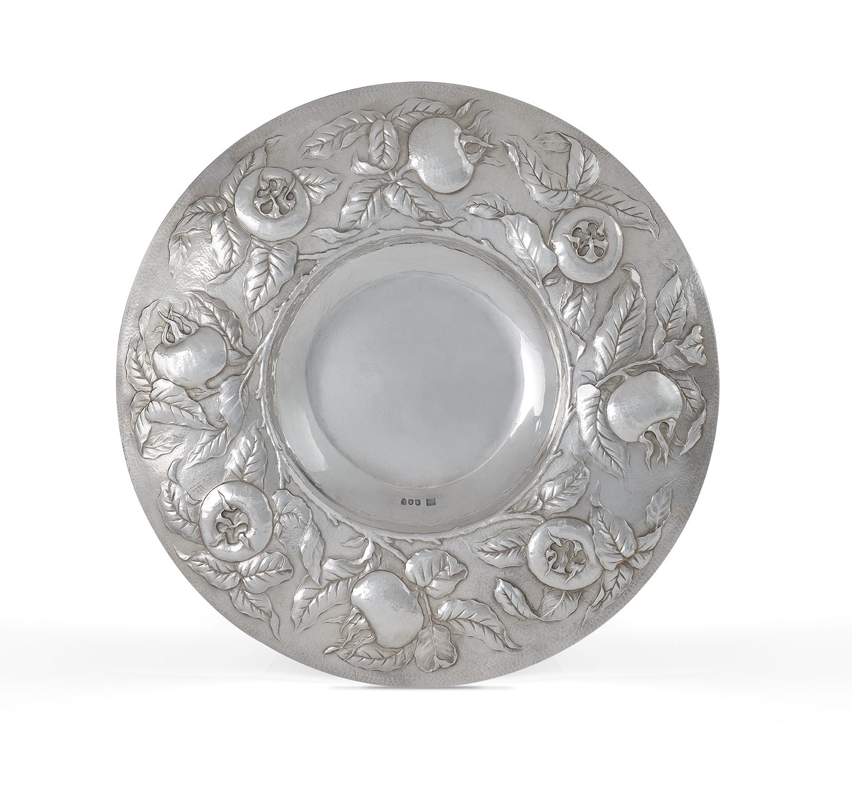 A silver charger by Gilbert Marks