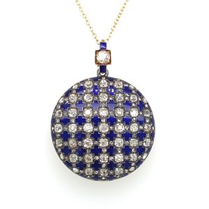 An antique enamelled gold and diamond set pendant