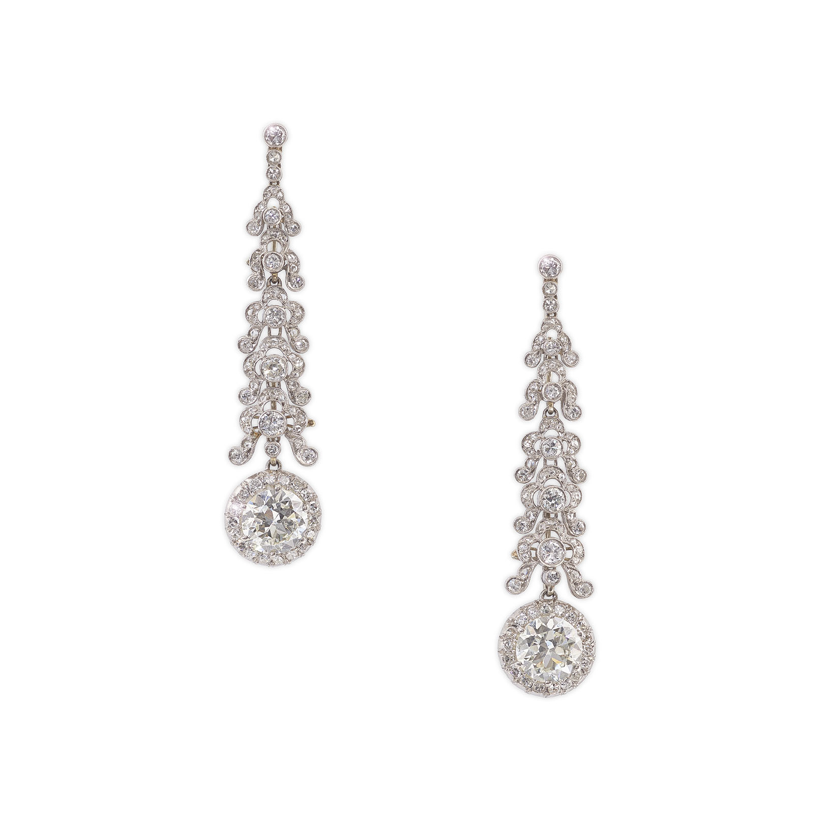 A pair of platinum and diamond drop earrings