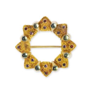 A gold brooch by Robert Naughten