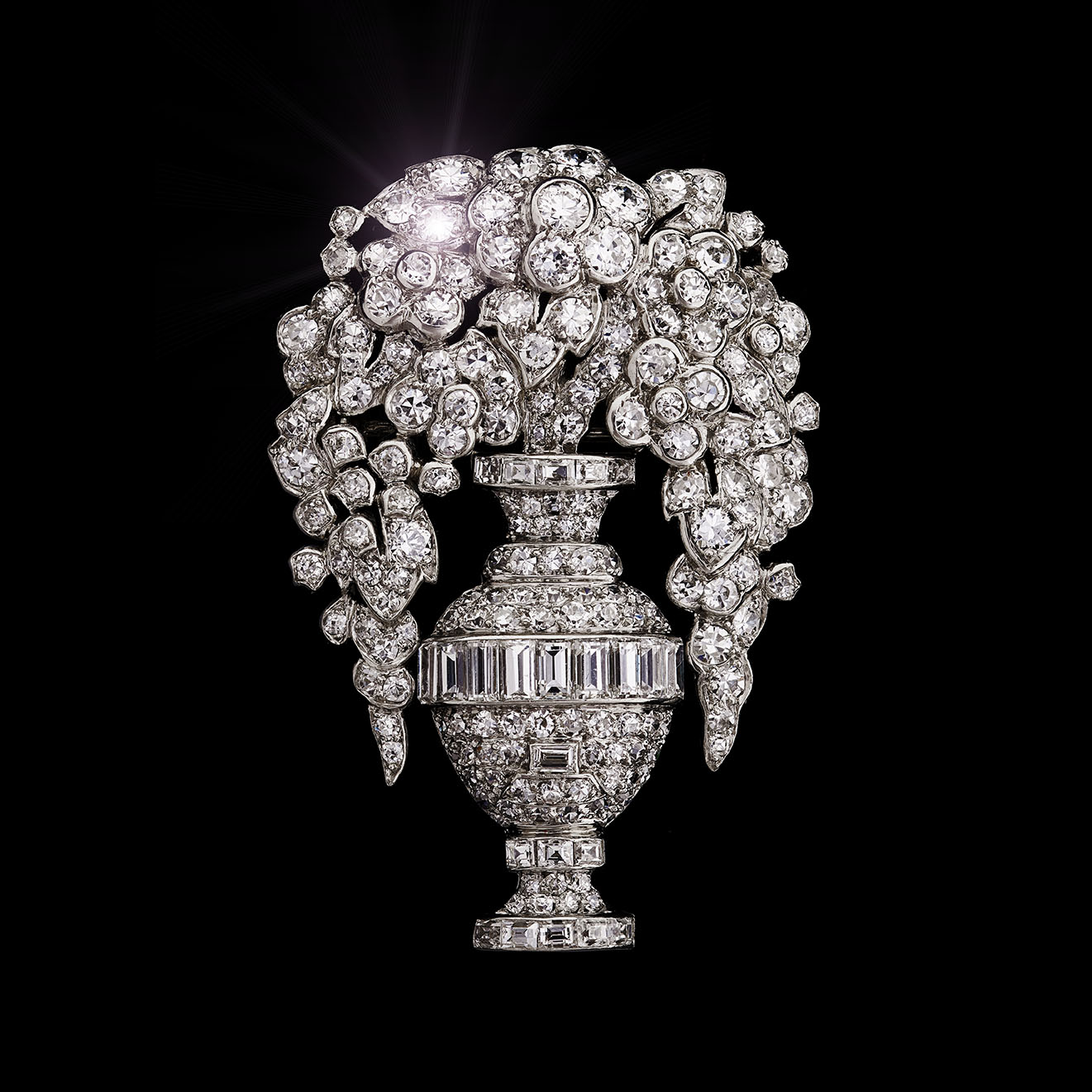 A platinum mounted diamond-set brooch by Lacloche Frères