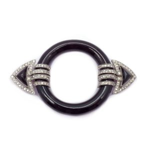 An Art Deco onyx and diamond brooch by Marzo