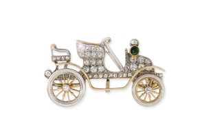A platinum mounted gem-set automotive brooch