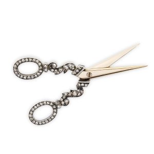 An antique diamond set scissor brooch