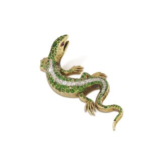 A jewelled gold lizard brooch