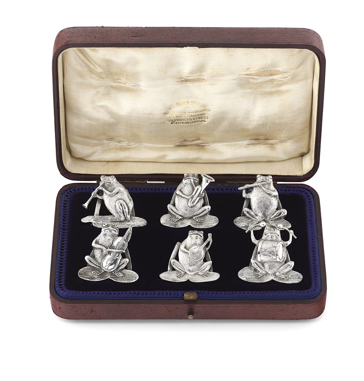A set of six novelty silver menu holders by Samuel Jacob
