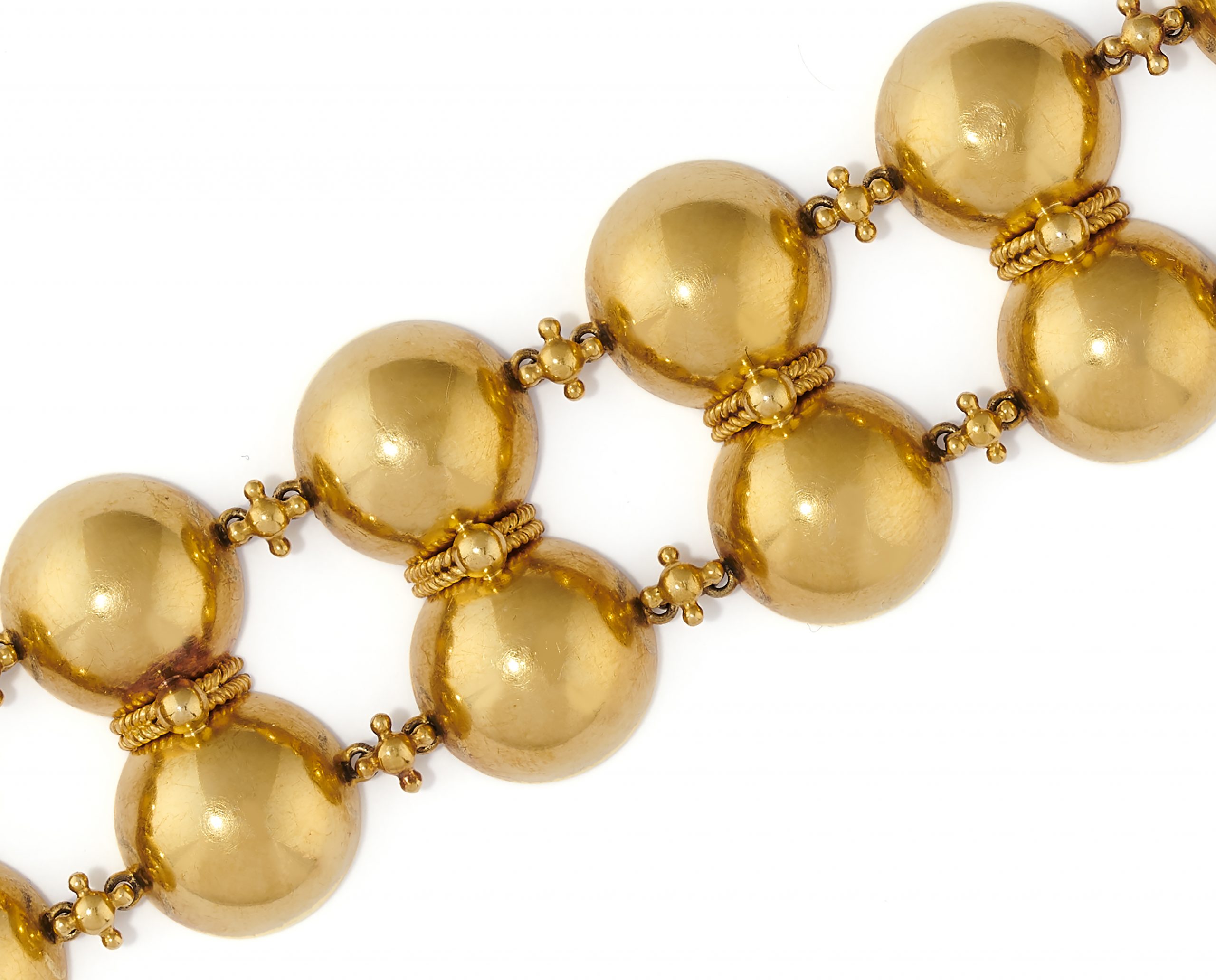 A gold bracelet by Phillips Brothers
