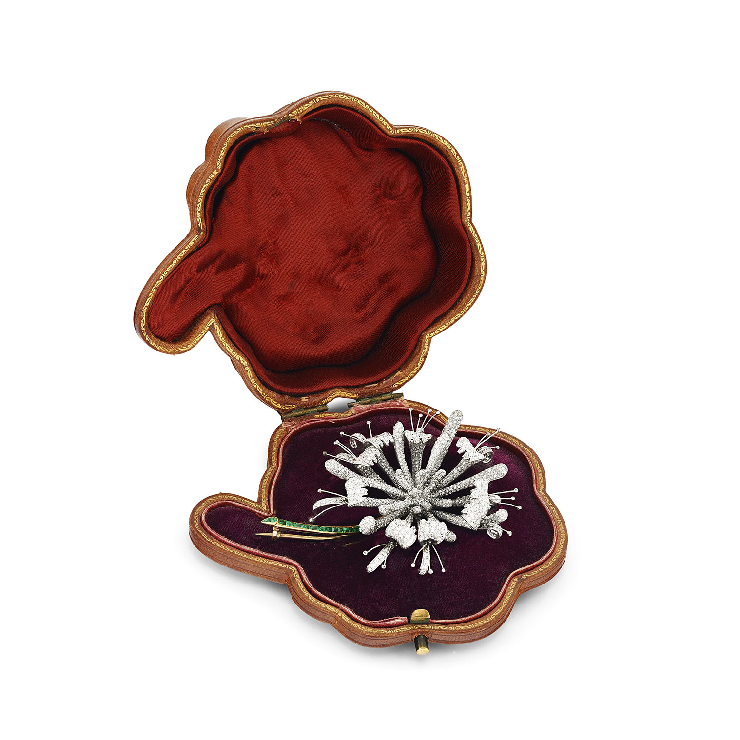 A platinum mounted diamond and emerald honeysuckle brooch