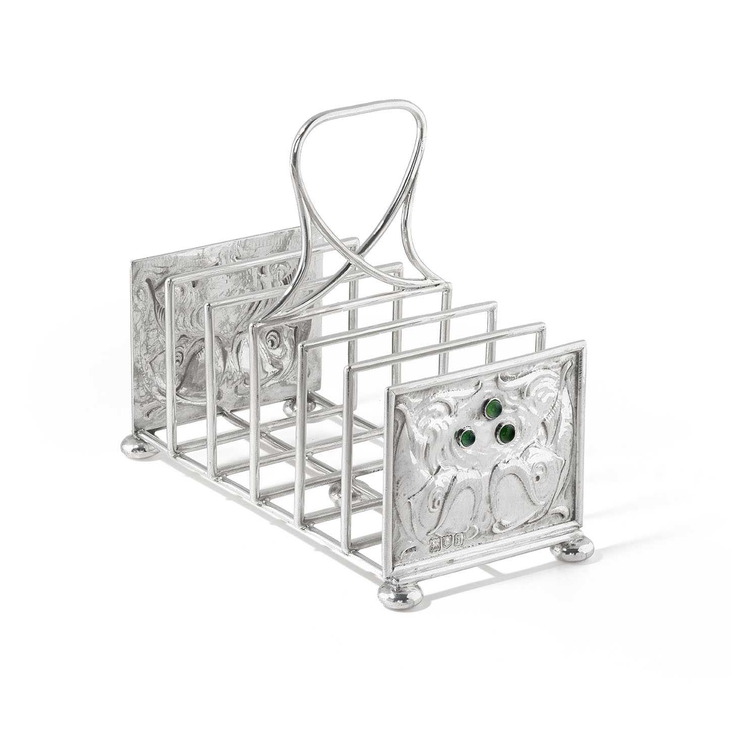 A rare silver and gem-set toast rack by The Guild of Handicraft