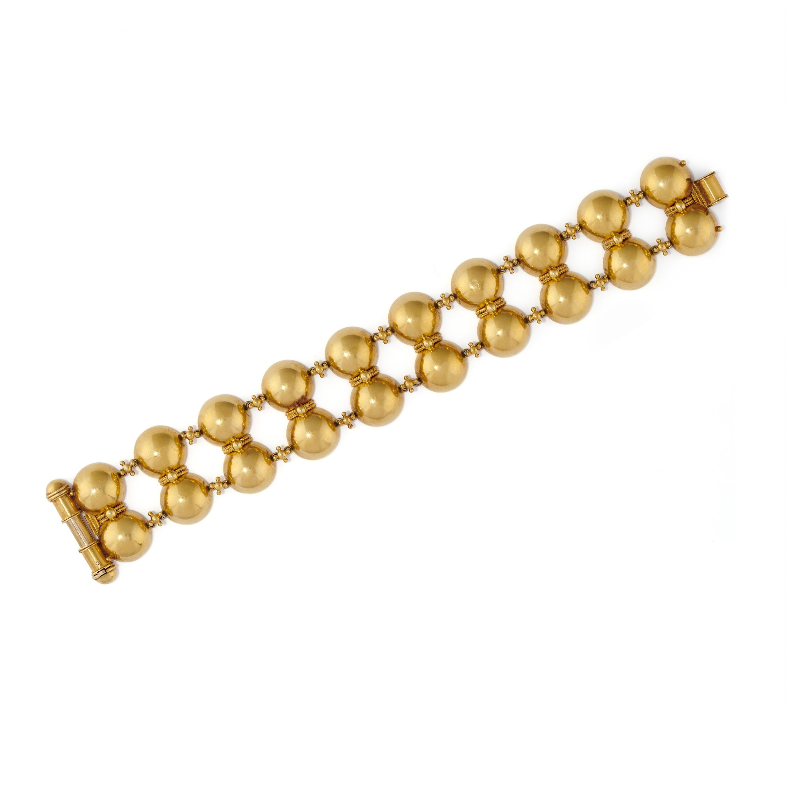 A gold bracelet by Phillips Brothers